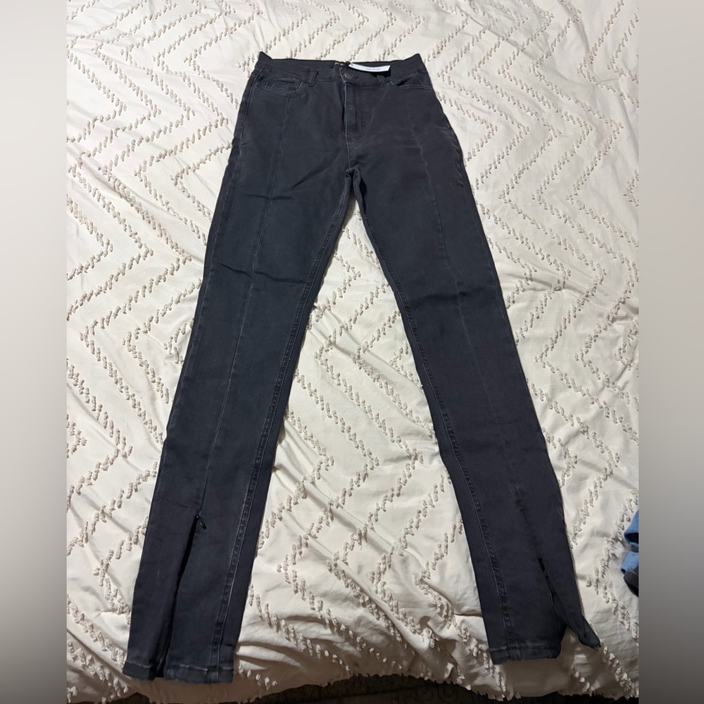 Nasty gal size 10 black skinny jeans. With split zip hem.
